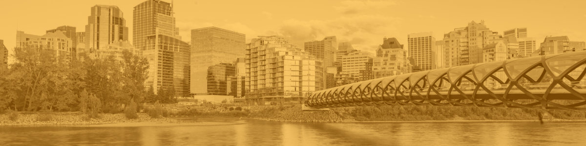 A photo of the peace bridge in Calgary, edited with a wash of orange for the National Day for Truth and Reconciliation. 