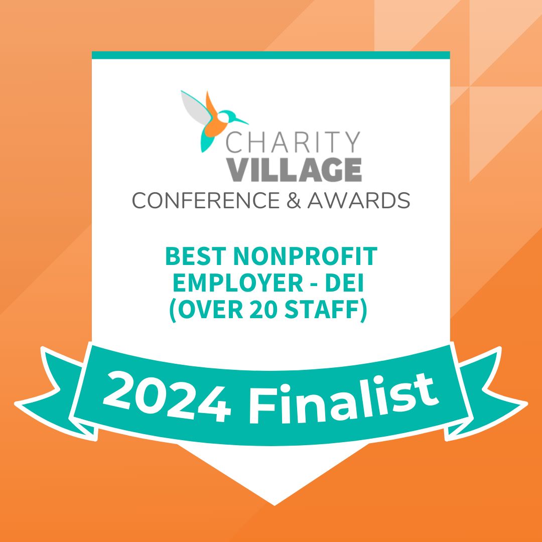 Orange and blue Charity Village Award Badge